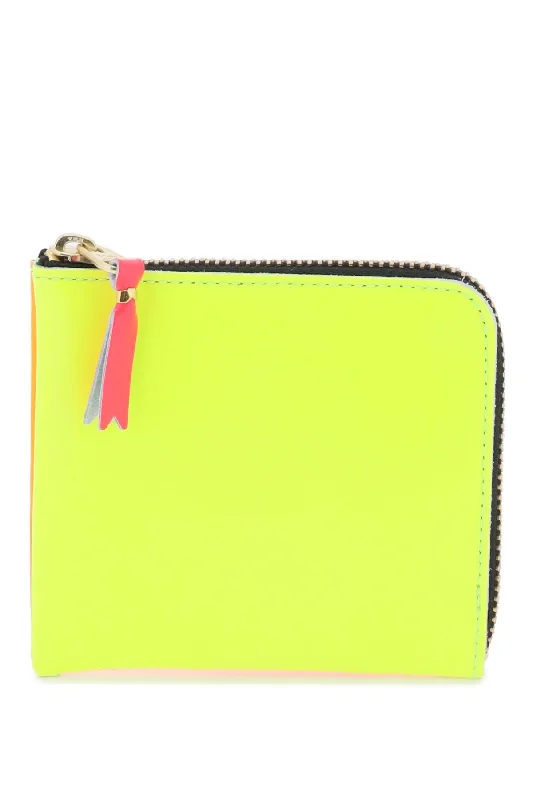 Vintage-style money clips for collectors Leather Passport Covers & Wallets with Handmade Stitching for Luxury TravelersComme Des Garcons Wallet Men's Super Fluo Small Bifold Wallet